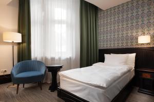 Postel nebo postele na pokoji v ubytování Brovaria Boutique Hotel Stary Rynek - Old Town Square