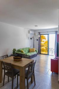 a living room with a table and a couch at Ocean View Luxury in Santa Maria