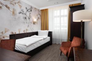 Postel nebo postele na pokoji v ubytování Brovaria Boutique Hotel Stary Rynek - Old Town Square