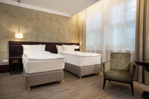 Postel nebo postele na pokoji v ubytování Brovaria Boutique Hotel Stary Rynek - Old Town Square