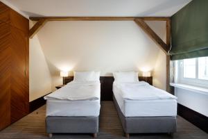 Postel nebo postele na pokoji v ubytování Brovaria Boutique Hotel Stary Rynek - Old Town Square