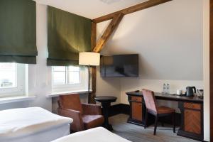 Postel nebo postele na pokoji v ubytování Brovaria Boutique Hotel Stary Rynek - Old Town Square