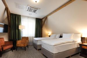 Postel nebo postele na pokoji v ubytování Brovaria Boutique Hotel Stary Rynek - Old Town Square