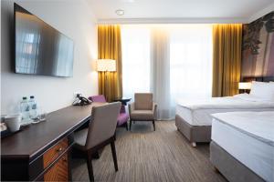 Postel nebo postele na pokoji v ubytování Brovaria Boutique Hotel Stary Rynek - Old Town Square