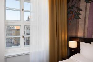 Postel nebo postele na pokoji v ubytování Brovaria Boutique Hotel Stary Rynek - Old Town Square