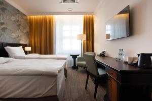 Postel nebo postele na pokoji v ubytování Brovaria Boutique Hotel Stary Rynek - Old Town Square