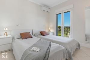 Posteľ alebo postele v izbe v ubytovaní Villa La Corona by Abahana Villas + 18 fotografií