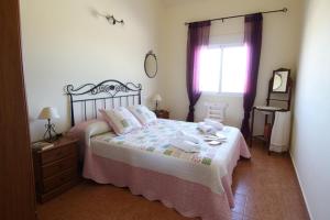 a bedroom with a bed and a dresser and a window at HL 002 4 bedroom country house, Fuente Alamo in El Espinar +18 photos
