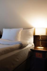 Postel nebo postele na pokoji v ubytování Brovaria Boutique Hotel Stary Rynek - Old Town Square