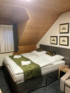 Postel nebo postele na pokoji v ubytování Hotel a vinařství Sádek