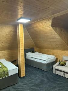 Postel nebo postele na pokoji v ubytování Hotel a vinařství Sádek