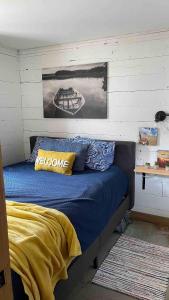 Ένα ή περισσότερα κρεβάτια σε δωμάτιο στο Cozy Timbers