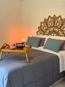 a bedroom with a bed with a table on it at Home4u Acogedor apartamento en Maracena in Maracena +32 photos
