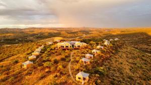 an aerial view of a row of houses on a hill at River Crossing Lodge in Windhoek