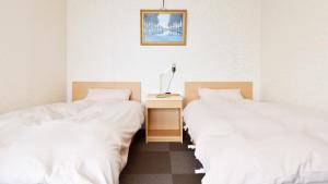 Postel nebo postele na pokoji v ubytování Yamanoyu Sekizen + 33 fotografií