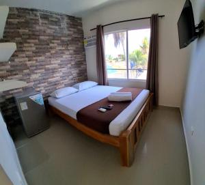 Postel nebo postele na pokoji v ubytování Hotel Playarena
