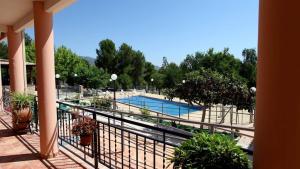 a balcony with a view of a swimming pool at Retiro Gastro-Rural - Casa 2 in Moratalla