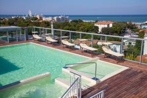 a swimming pool on the balcony of a building at Hotel Aria in Rimini