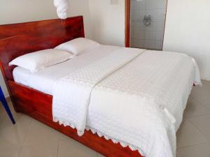 Postel nebo postele na pokoji v ubytování Agape House Kisoro