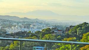 a view of a city with mountains in the background at Cozy House in Rio de Janeiro +34 photos