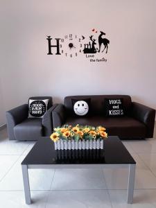 a living room with a couch and a table at BIG Two Bedrooms 1-6 Pax Luxury Condo at D Secret Garden - Johor Bahru-Setia Tropika-UTM-Mid Valley-Paradigm Mall in Johor Bahru