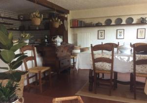 a kitchen with a table and chairs in a room at Belvedere 10 in Pietrasanta