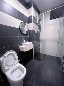 a bathroom with a toilet and a sink and a shower at BIG Two Bedrooms 1-6 Pax Luxury Condo at D Secret Garden - Johor Bahru-Setia Tropika-UTM-Mid Valley-Paradigm Mall in Johor Bahru +23 photos