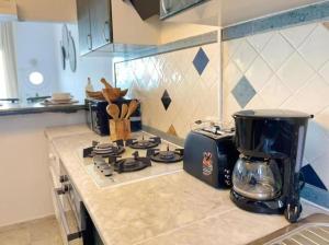 Η κουζίνα ή μικρή κουζίνα στο The Waterfront apartment +7 φωτογραφίες