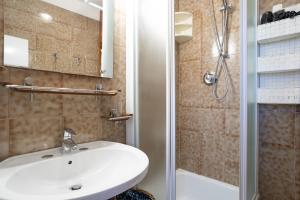 Koupelna v ubytování Maggio - appartamento con piscina + 9 fotografií