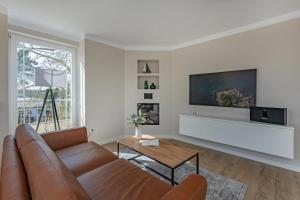 TV a/nebo společenská místnost v ubytování Haus Strandoase 24
