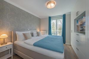 Postel nebo postele na pokoji v ubytování Haus Strandoase 24
