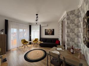 a living room with a couch and a table at Art-déco in Pécs
