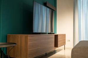 Μια τηλεόραση ή/και κέντρο ψυχαγωγίας στο Compagnoni Suite Luxe - Spa & Wellness