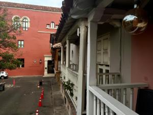 an empty street with orange cones in front of a building at EMMA HOTEL SAN DIEGO in Cartagena de Indias