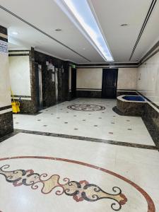 an empty room with a painting on the floor at Single private room with shared washroom and kitchen in Sharjah