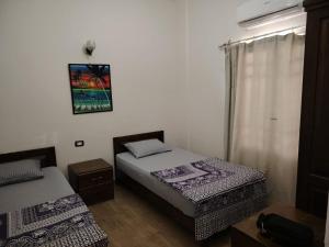 Postel nebo postele na pokoji v ubytování Gardenia House