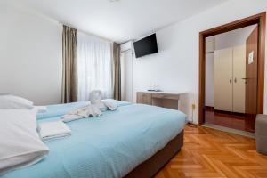 Posteľ alebo postele v izbe v ubytovaní Villa Okruk-10 meters away from the beach