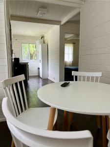 a white table and chairs in a room at Las Luciérnagas del Delta 1 in Tigre +13 photos