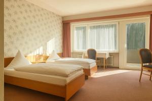 Letto o letti in una camera di Hotel Bad Ramsach