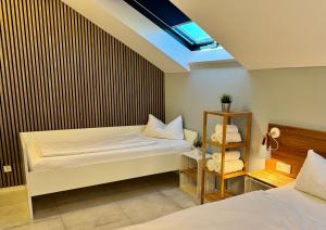 Ένα ή περισσότερα κρεβάτια σε δωμάτιο στο JUNIPRO Apartments Bostalsee