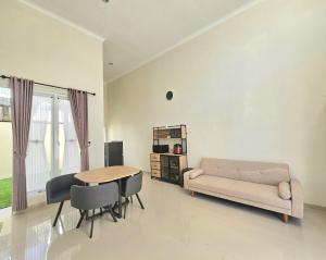 a living room with a couch and a table at Villa Kayana AA9 in Batu