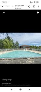 a screenshot of a picture of a swimming pool at La Cigale d'Avignon in Saint-Saturnin-lès-Avignon