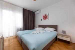 Posteľ alebo postele v izbe v ubytovaní Villa Okruk-10 meters away from the beach