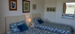 a small bedroom with a bed and a mirror at River View in Rochester
