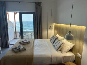 Ένα ή περισσότερα κρεβάτια σε δωμάτιο στο Anfi Suites