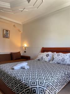 Llit o llits en una habitació de Hotel Ryad Tetouan Aero