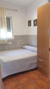 Posteľ alebo postele v izbe v ubytovaní Casa del Almendro