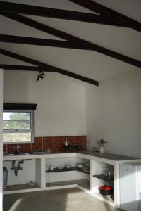 a kitchen with a white counter top in a room at Farm Hohenheim in Hohenheim