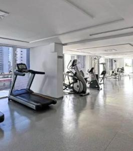 a gym with several exercise bikes in a room at Santorini na rua do hospital Premium Mater Dei Piscina Academia Jacuzzi Parque Areiao e Goiania Shopping tudo perto in Goiânia
