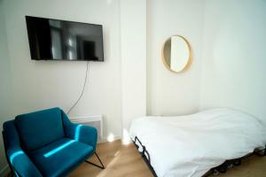 TV a/nebo společenská místnost v ubytování Smart Appart - City